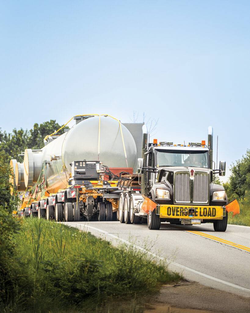 Truck with vessel coming down hill